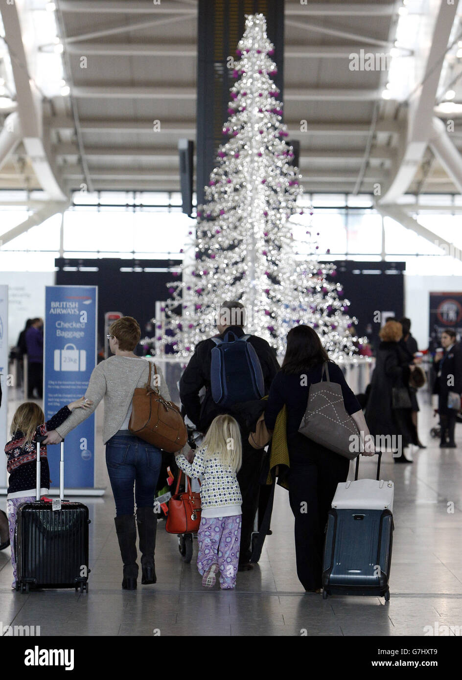 Passengers arrive to drop off their bags at Terminal 5 of Heathrow