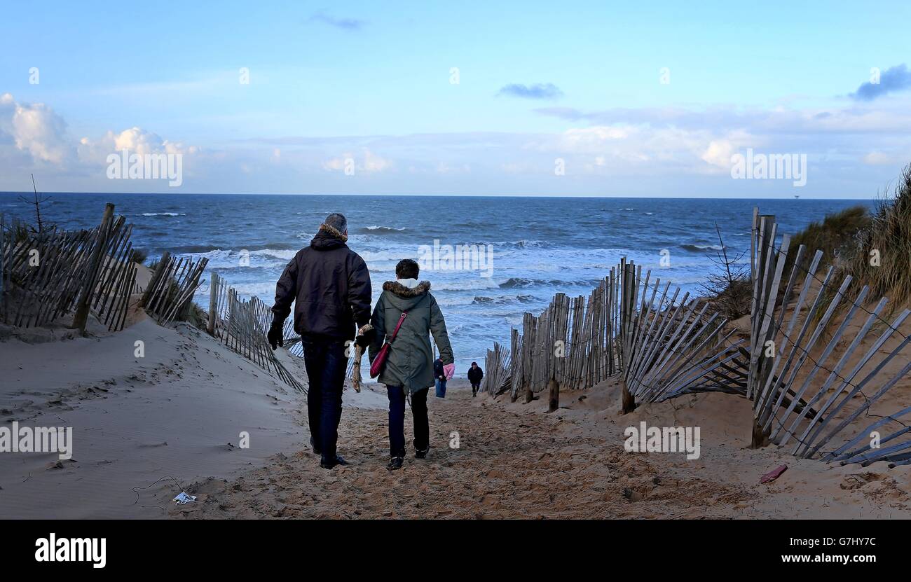 Dog walkers enjoy a Christmas day stroll along Formby Point, Merseyside
