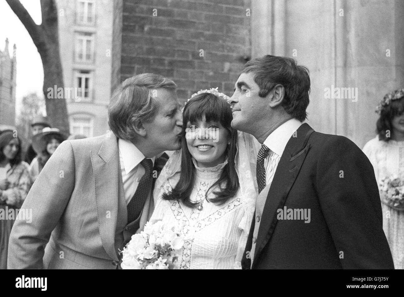 Comedy actor and TV personality Lance Percival, 44, kisses his new bride, Serena Perkins, a 28-year-old receptionist daughter of a London businessman, after their marriage at St Paul's Church, Knightsbridge. Stock Photo