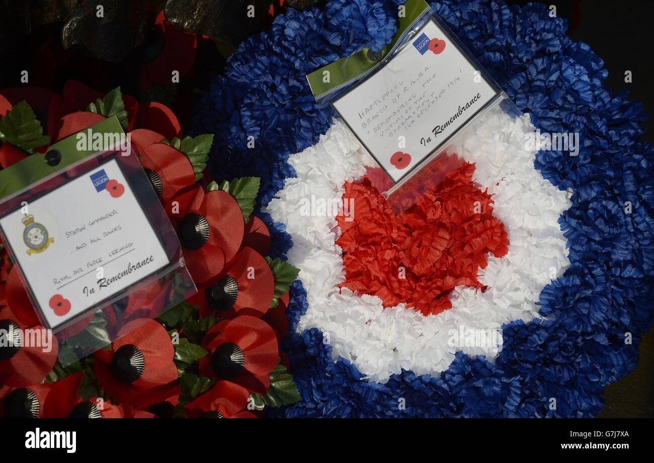 Poppies are left by the plaque in Hartlepool, as the town devastated by the 1914 German bombardment of the North East coast commemorates the 100th anniversary of the attack. Stock Photo