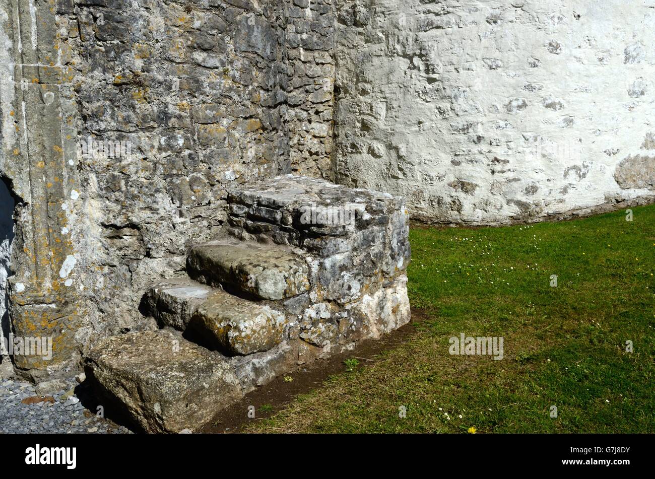 Old stone mounting block outside Oxwich Castle Gower Peninsula Wales Stock Photo