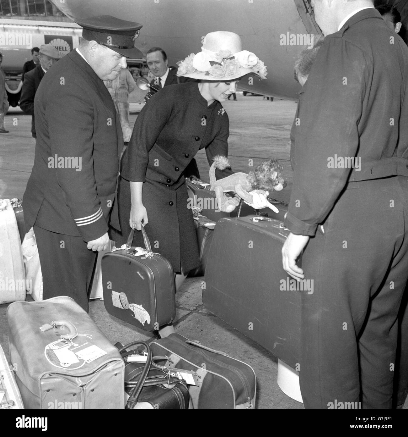 Marilyn (Mandy) Rice-Davies, 18-year-old witness in the Stephen Ward case, with her luggage at London Airport as she left for Palma, Majorca. Her flight was delayed, but when she eventually went to board the aircraft she was escorted by two airport policemen. Stock Photo