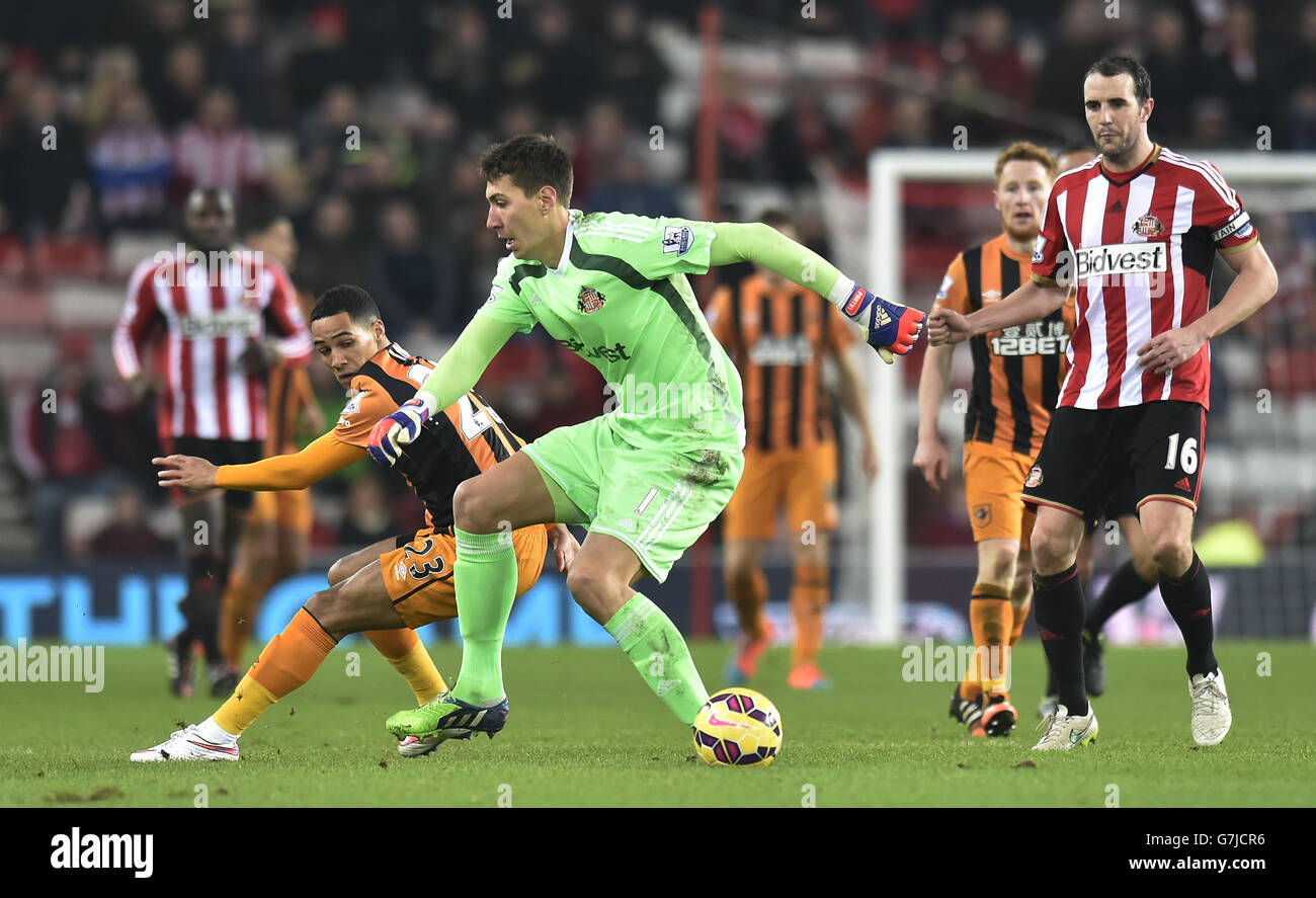 Sunderland's Costel Pantilimon gets caught out of the box with Hull City's Tom Ince during the Barclays Premier League match at the Stadium of Light, Sunderland. Stock Photo