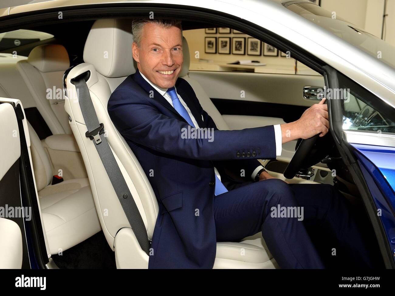 Chief Executive of Rolls-Royce Motor Cars Torsten Muller Otvos sits in a Rolls  Royce car in the company's Berkley Square showroom in Mayfair, London,  before the announcement of their annual financial results