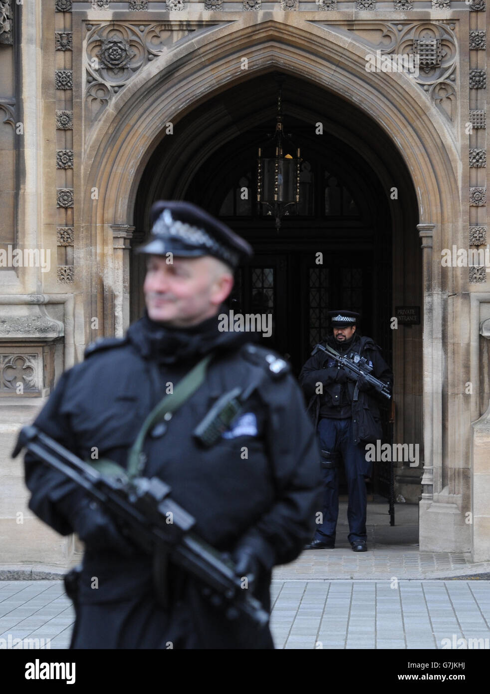 Armed police officers outside the Houses of Parliament in London, as ...