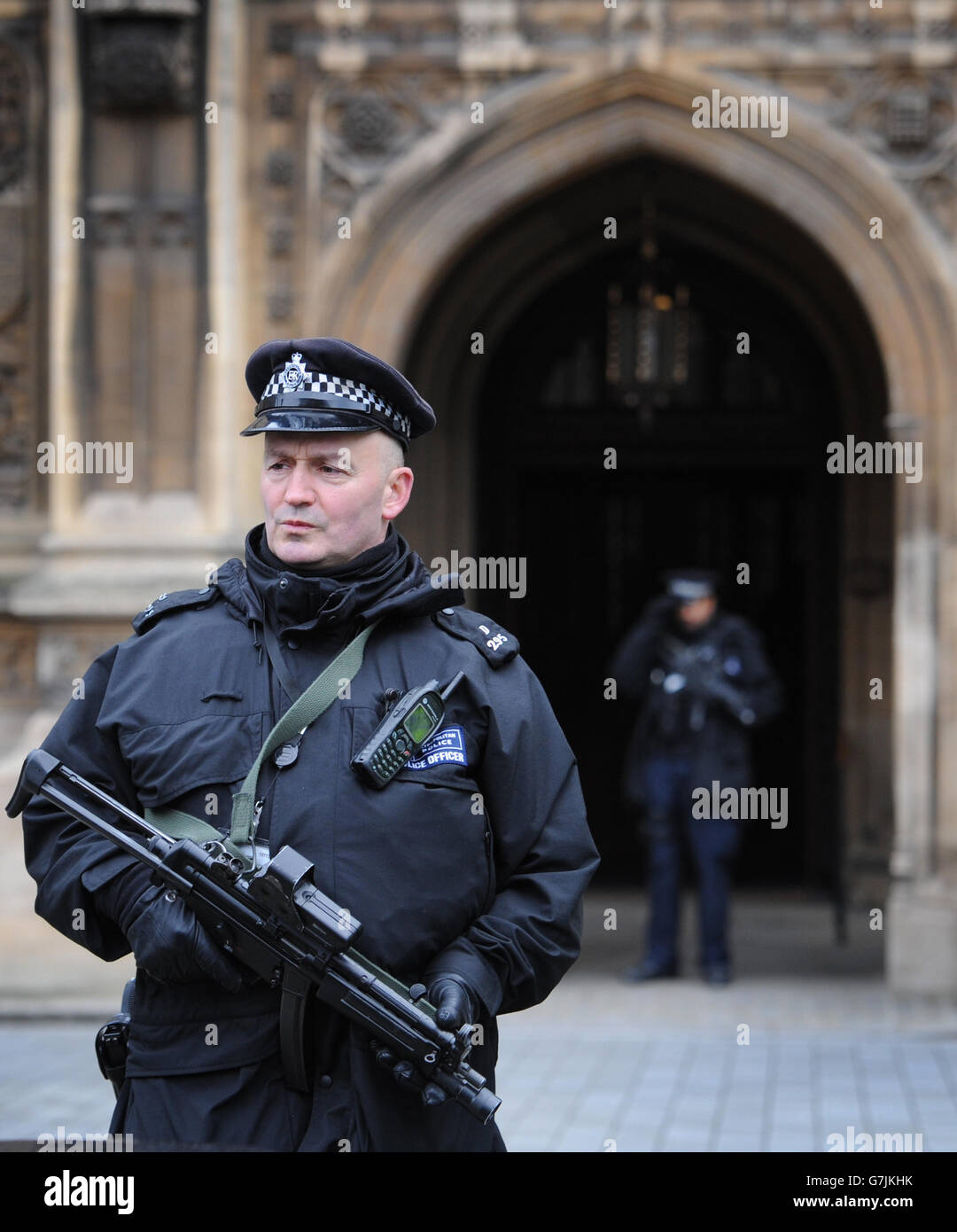 Armed police officers outside the Houses of Parliament in London, as ...