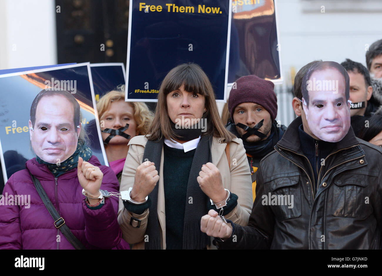 Friends and colleagues of Al-Jazeera journalists Peter Greste, Baher Mohammed and Mohammed Fahmy hold a protest outside the Egyptian embassy in London to mark a year since their incarceration by Egyptian authorities over terror charges. Stock Photo