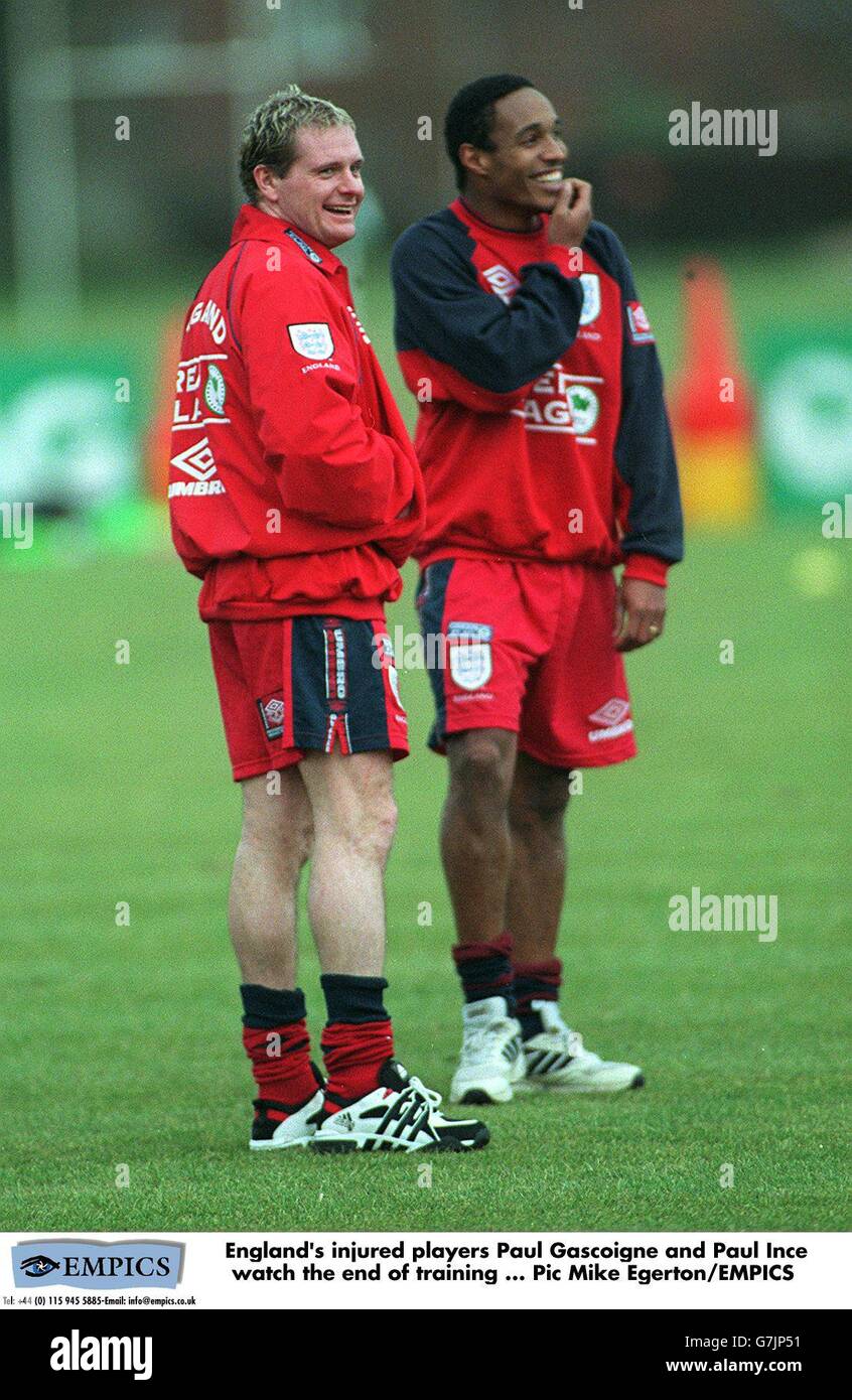 England's injured players Paul Gascoigne and Paul Ince watch the end of ...