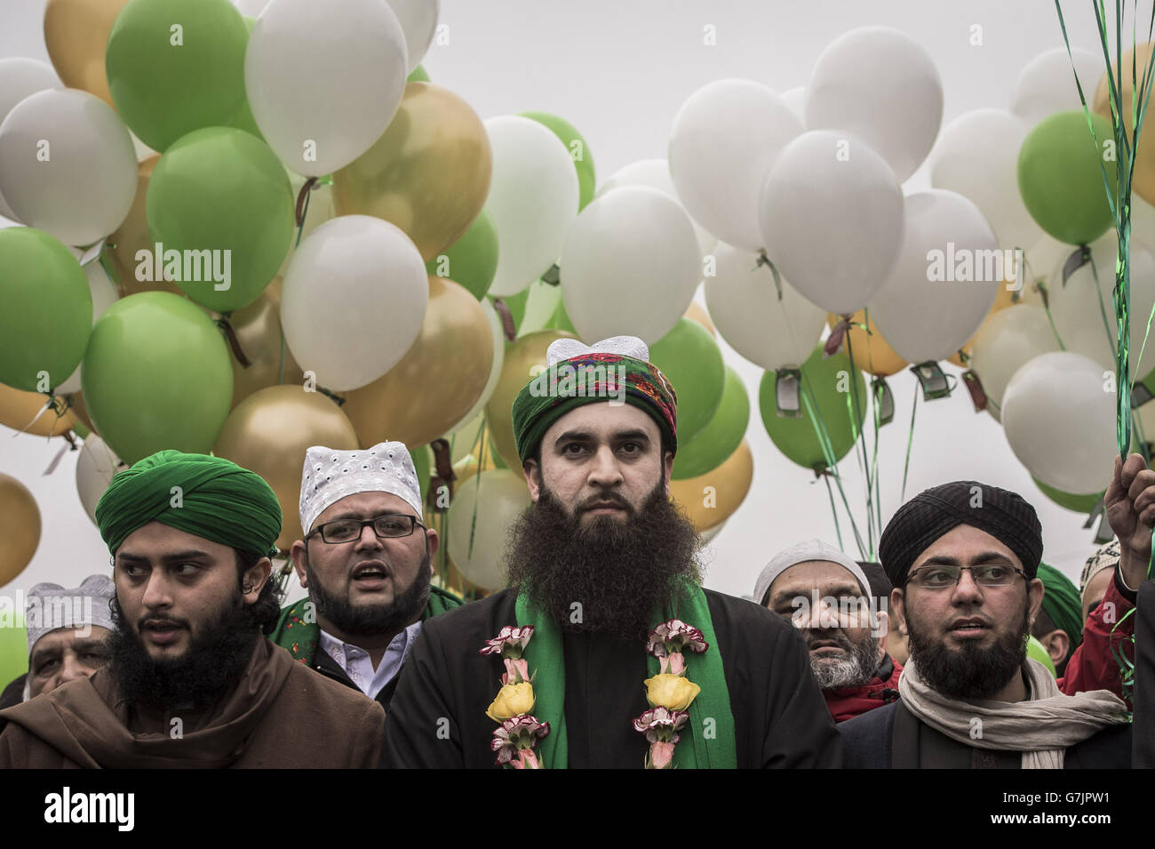 Members from the Easton Jamia Masjid, also known as the Easton Mosque, take part in a religious procession celebrating the Prophet Muhammad's birthday, through the streets of Easton, Bristol. Stock Photo