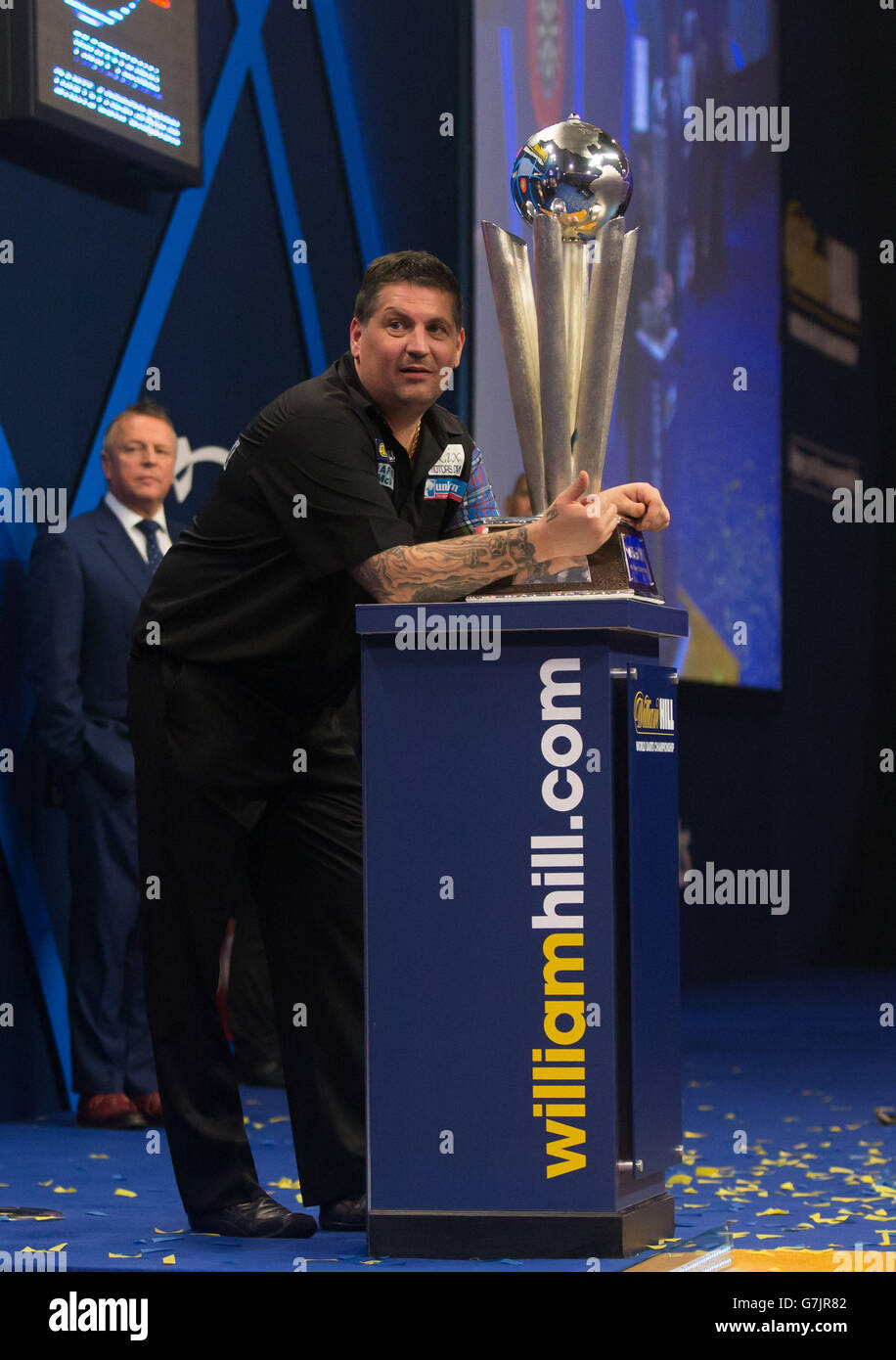 Gary Anderson celebrates with the Sid Waddell trophy after defeating