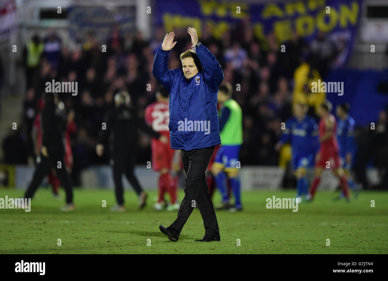 Soccer - FA Cup - Third Round - AFC Wimbledon v Liverpool - The Cherry Red Records Stadium. AFC Wimbledon manager Neal Ardley applauds the fans after the match Stock Photo