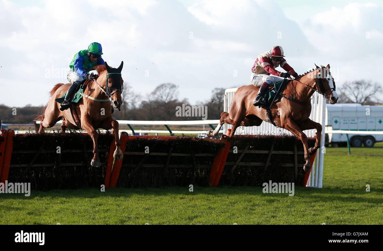 Vesuvhill ridden by Daryl Jacob (left) jumsp the last with Avel Vor ridden by Richard Johnson on their way to victory in the Betfred Goals Galore Novices&acute; Handicap Hurdle on Betfred Classic Chase Day at Warwick Racecourse, Warwick. Stock Photo