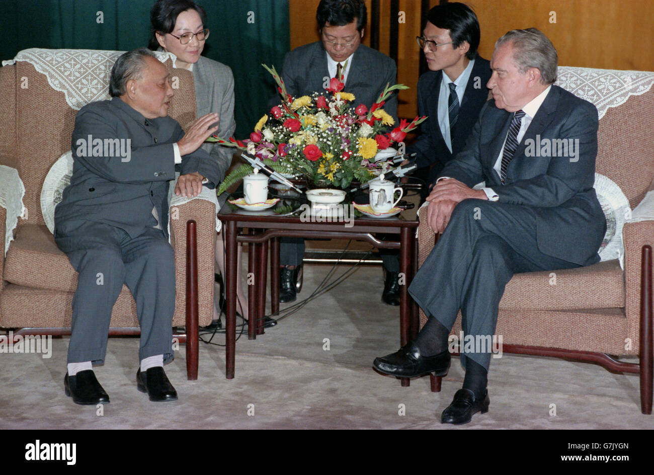 Former US President Richard M. Nixon meets with Chinese Supreme Leader Deng Xiaoping in the Great Hall of the People October 31, 1989 in Beijing, China. Deng Xiaoping's youngest daughter Deng Rong, sits behind the leader serving as translator. Stock Photo