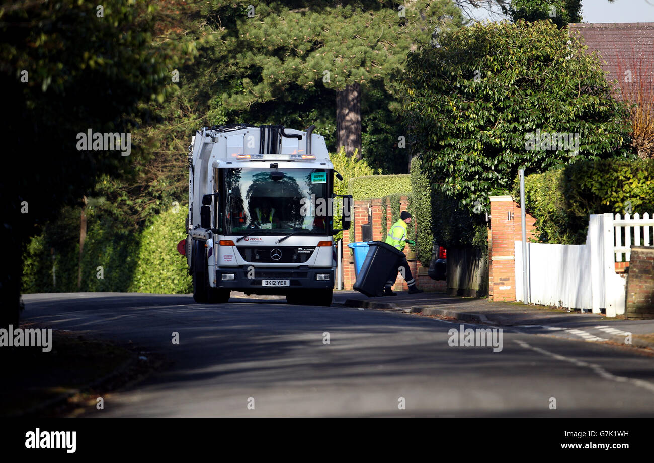 Rubbish stock. Council workers empty bins in Sunningdale, Berkshire