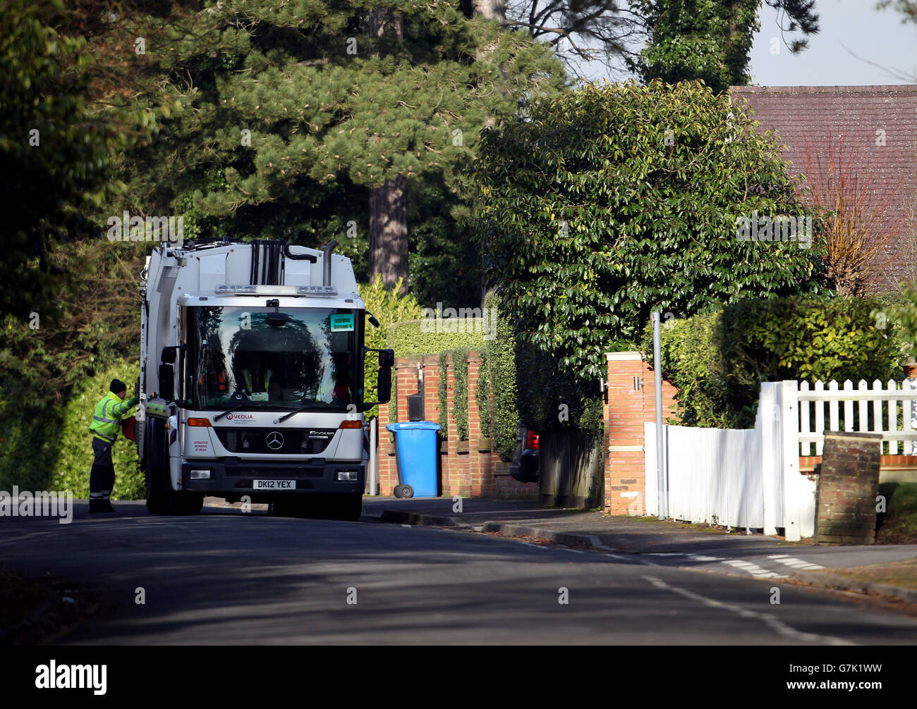 Council workers empty bins in Sunningdale, Berkshire Stock Photo Alamy