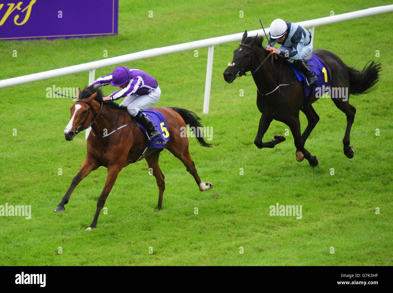 Minding ridden by Ryan Moore wins the Sea The Stars Pretty Polly Stakes during day three of the Dubai Duty Free Irish Derby Festival at Curragh Racecourse, Co. Kildare, Ireland. Stock Photo
