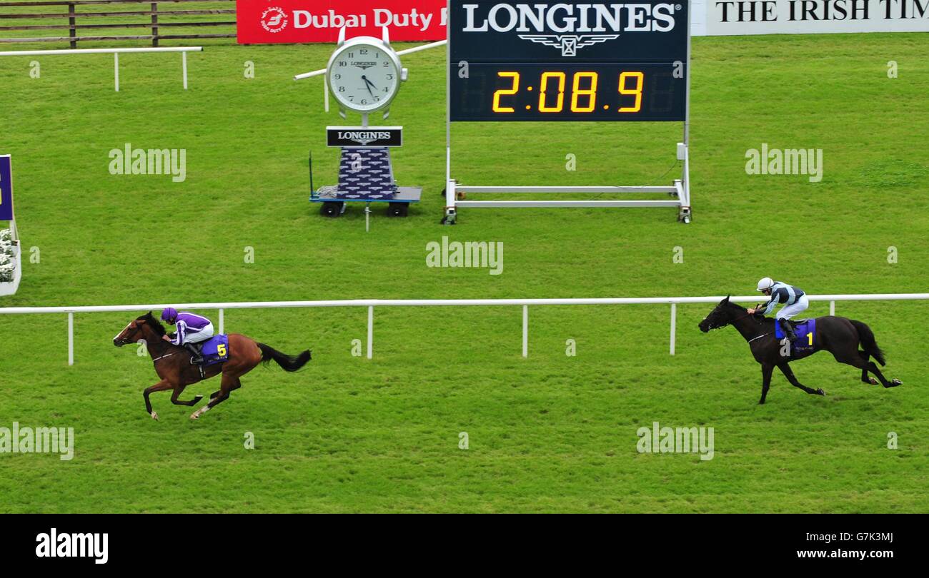 Minding ridden by Ryan Moore wins the Sea The Stars Pretty Polly Stakes during day three of the Dubai Duty Free Irish Derby Festival at Curragh Racecourse, Co. Kildare, Ireland. Stock Photo