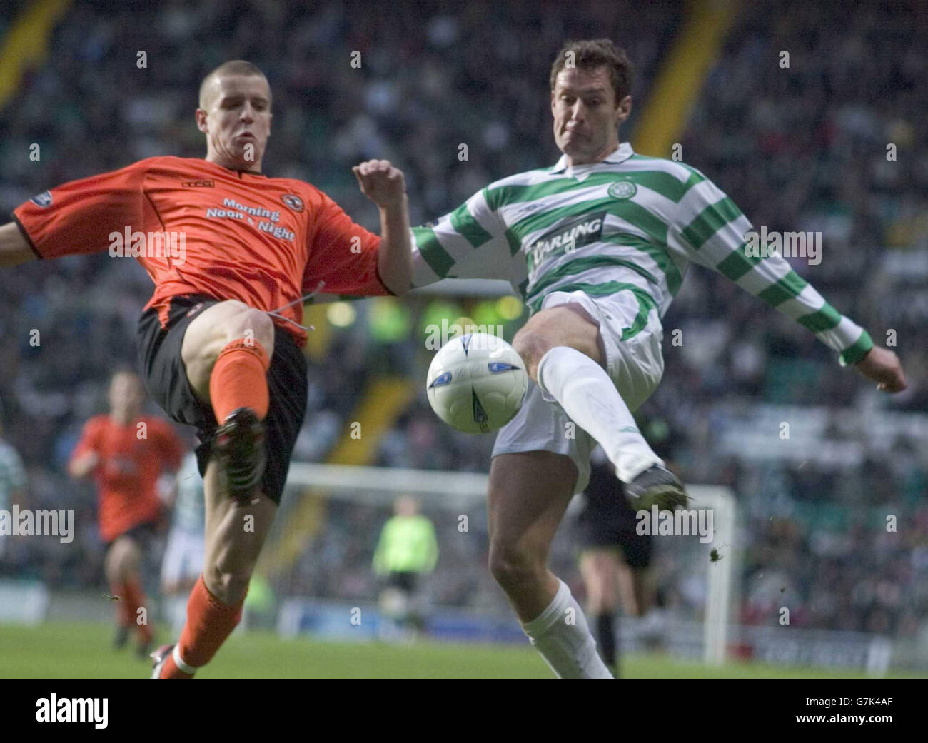 Dundee United's Chris Innes (left) and Chris Sutton of Celtic in action. . Stock Photo