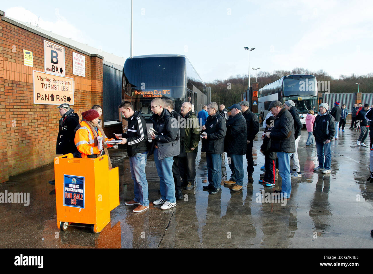 Swansea fans queuing for programmes at Ewood Park before the FA Cup Fourth Round match at Ewood Park, Blackburn. Stock Photo