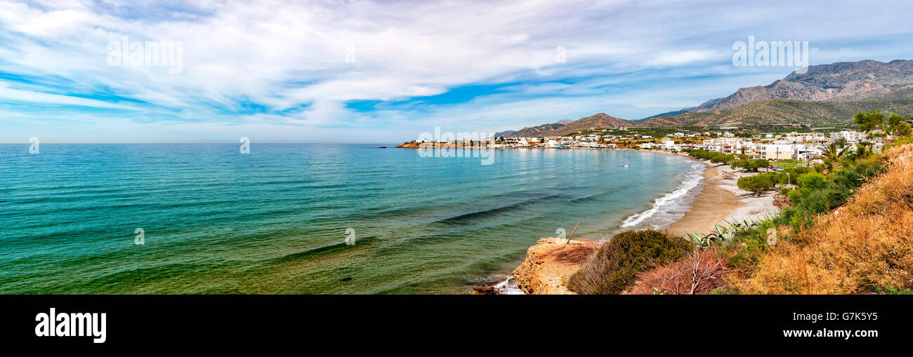 A panoramic view of one of the beaches by cliffs at Makrygialos on the Greek island of Crete. Stock Photo