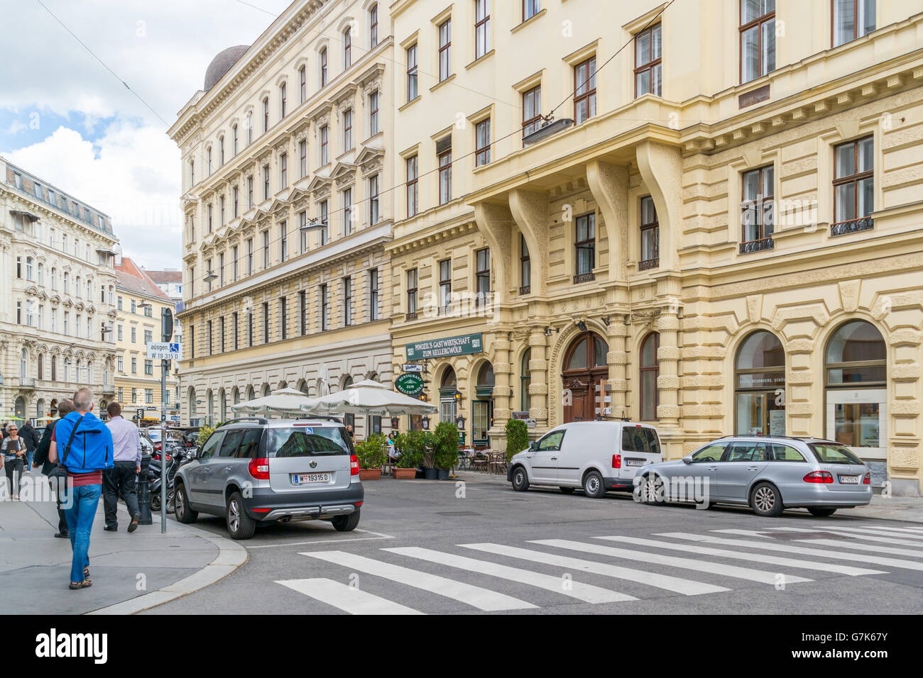 Street scene of Seilerstatte with people and parked cars in inner city of Vienna, Austria Stock Photo