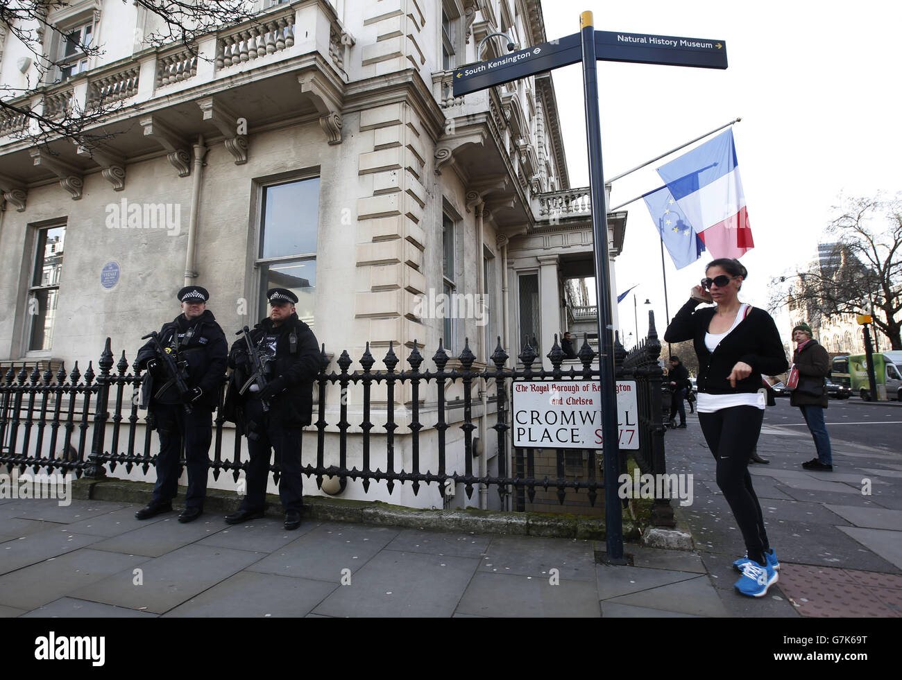 Armed police patrol outside the Chancellery of the French Consulate General, Cromwell Place, London as the new edition of French satirical magazine Charlie Hebdo went on sale in France and copies are expected to be available in the UK by the end of the week. Stock Photo