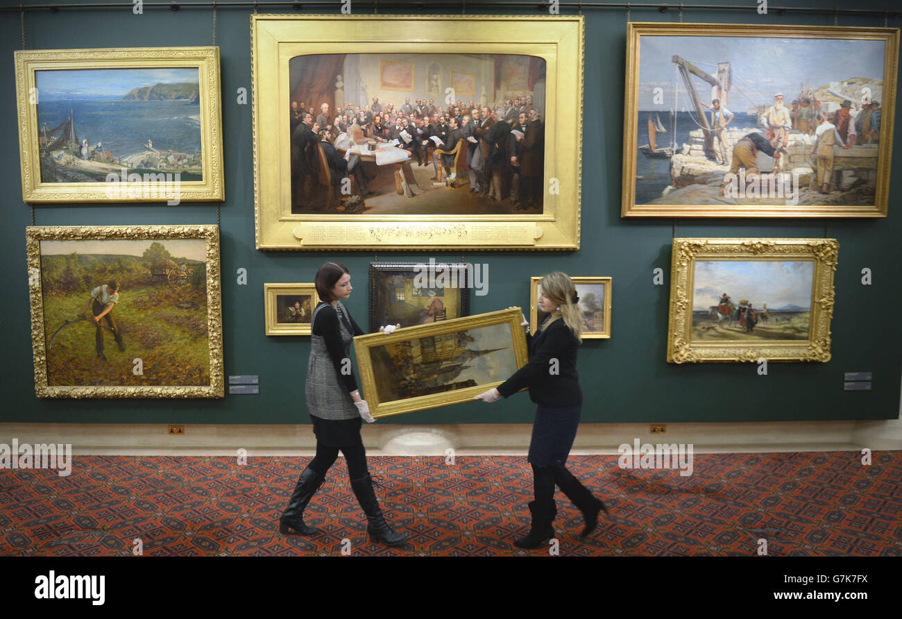 Guildhall Art Gallery Curators Julia Dudkiewicz And Katty Pearce Carry A Painting During The Guildhall Art Gallery S Re Launch Following A Re Hang For The First Time In 15 Years Guildhall Art Gallery London