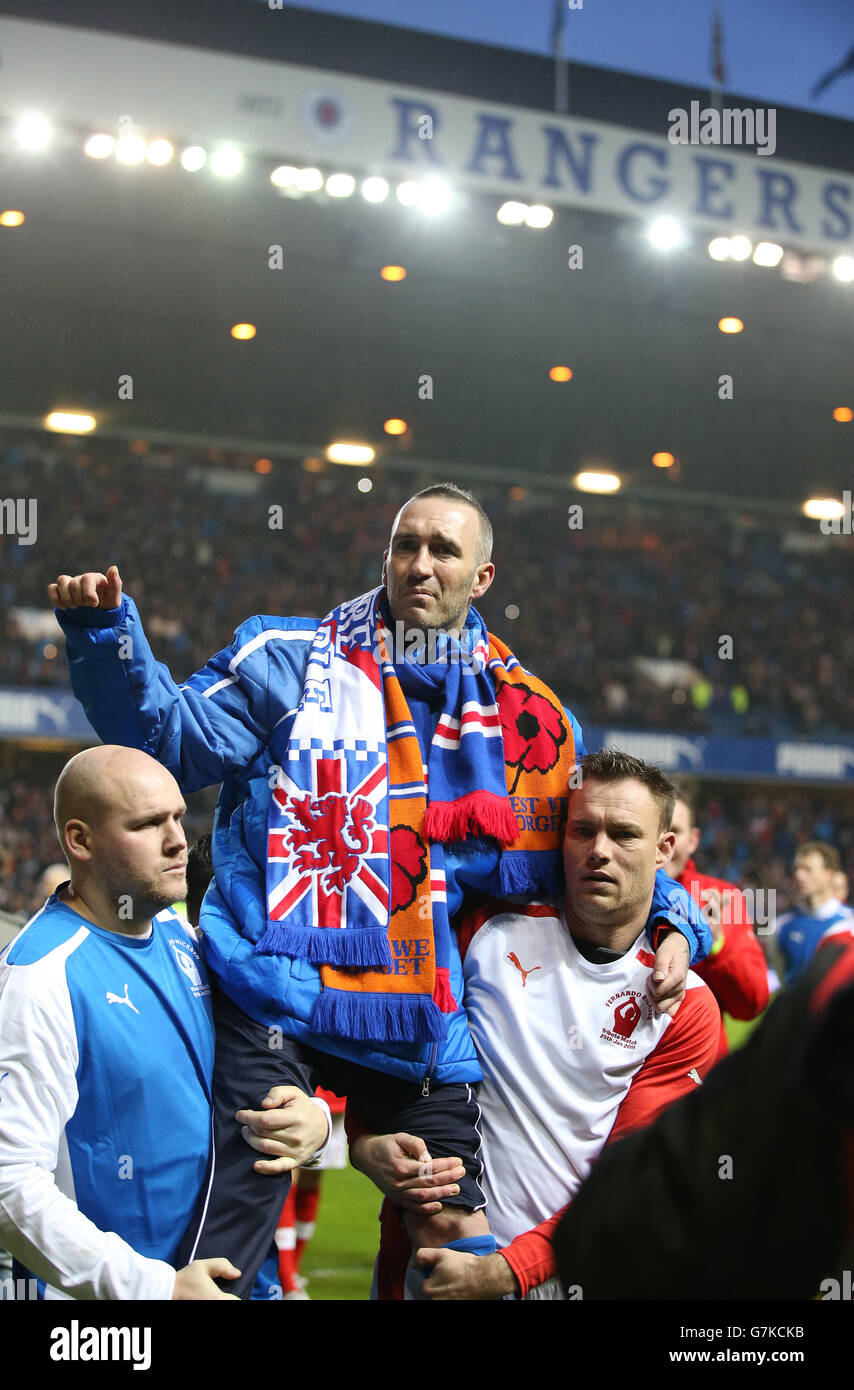 Fernando Ricksen is held up by his team mates after his tribute match ...
