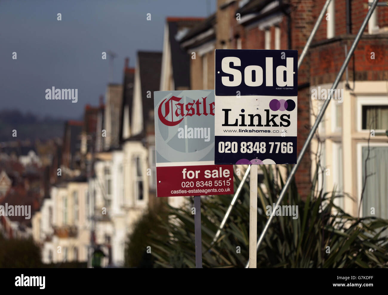 For Sale and Sold signs outside houses in north London. PRESS