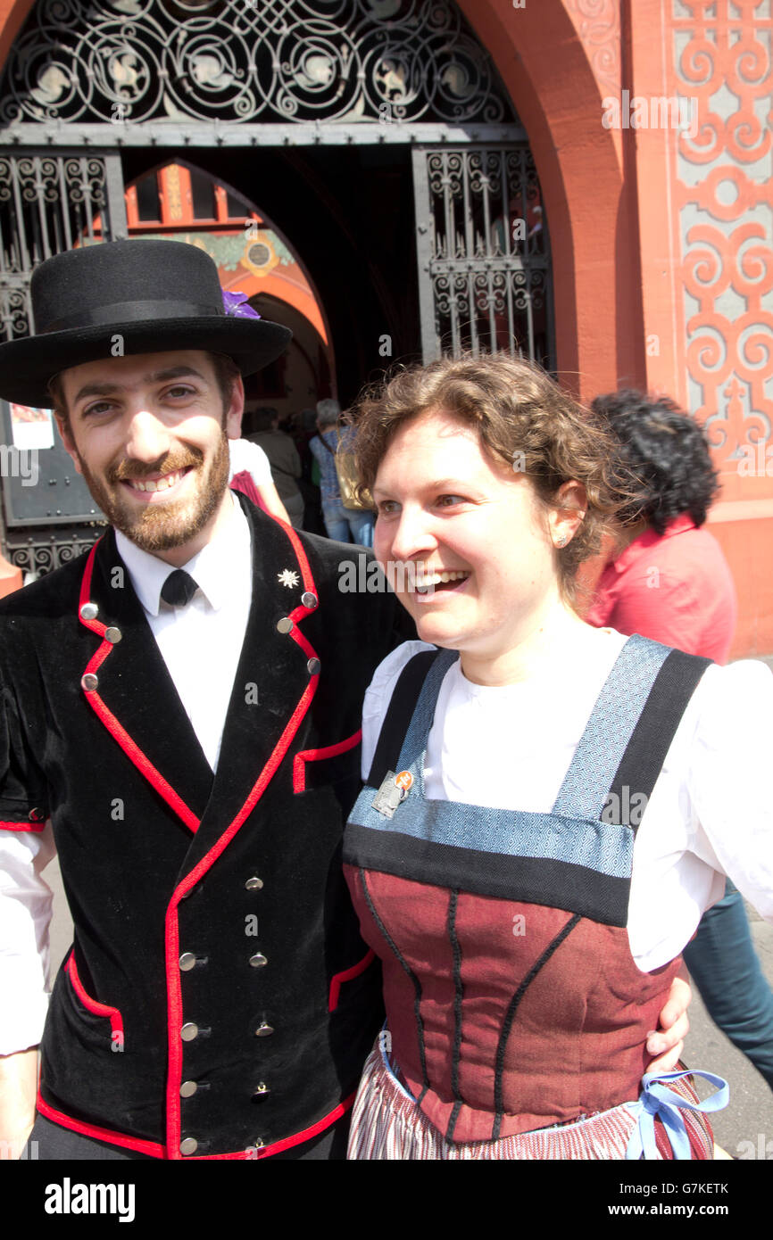 A pair of young choir members emerge from a folk music performance in