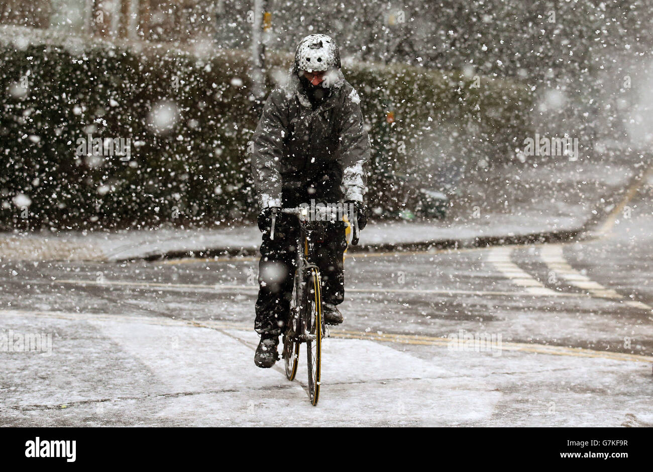 A cyclist on Dumbarton Road in Stirling during a snow blizzard, as a cold weather front is to