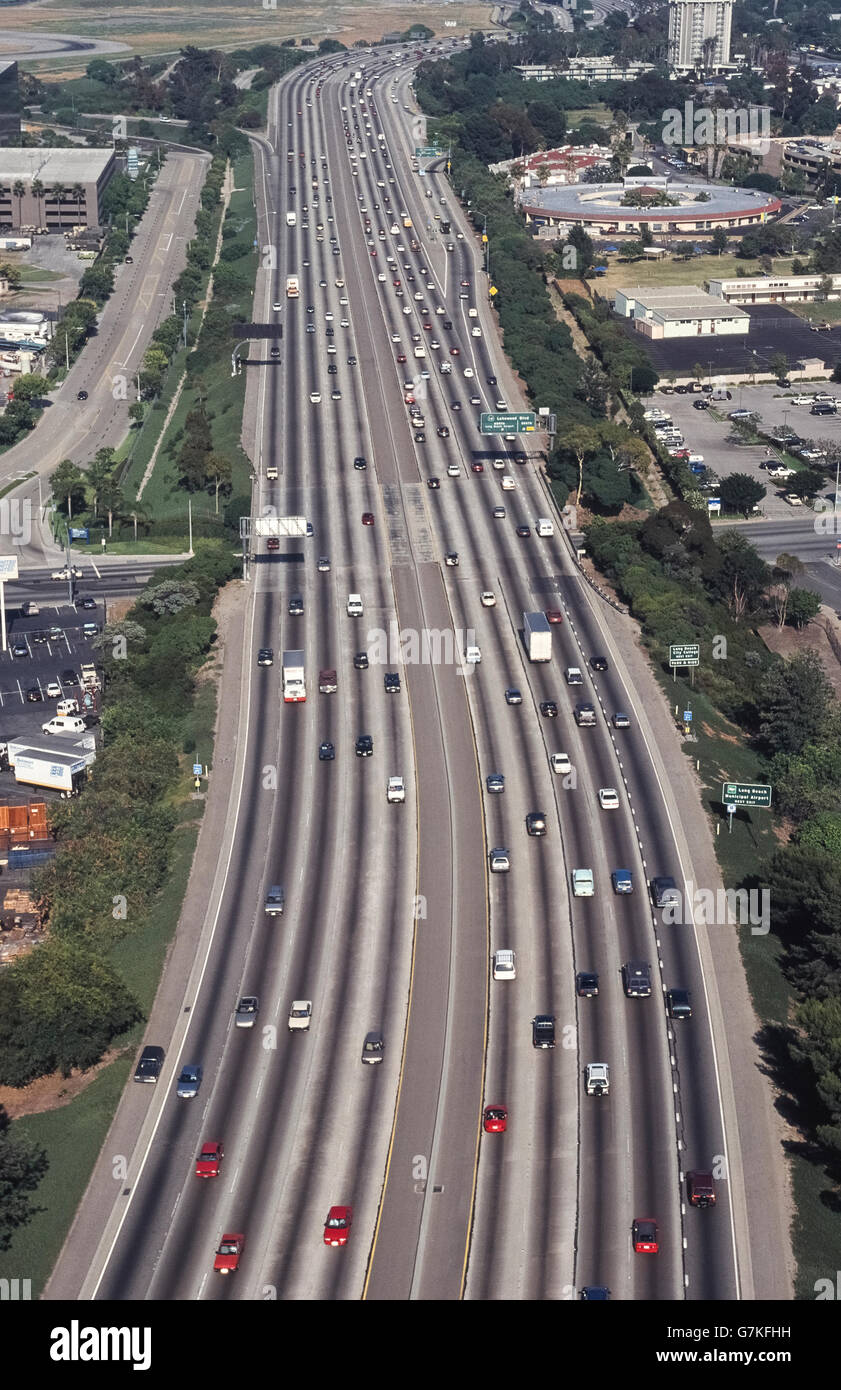 This aerial view shows a section of Interstate 405, which is a major north-south multilane highway in the Los Angeles area in Southern California, USA. Here it passes through the City of Long Beach near the Lakewood Boulevard/State Route 19 exit to the Long Beach Airport. This busy roadway is the northern segment of the San Diego Freeway, which drivers commonly call 'the 405' (four-oh-five). Stock Photo