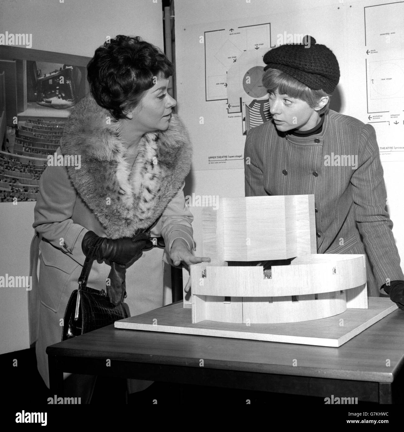 Actresses Joan Plowright (l) and Geraldine McEwan viewing a model of the proposed new building for the National Theatre at the Royal Institute of British Architects, London. Stock Photo