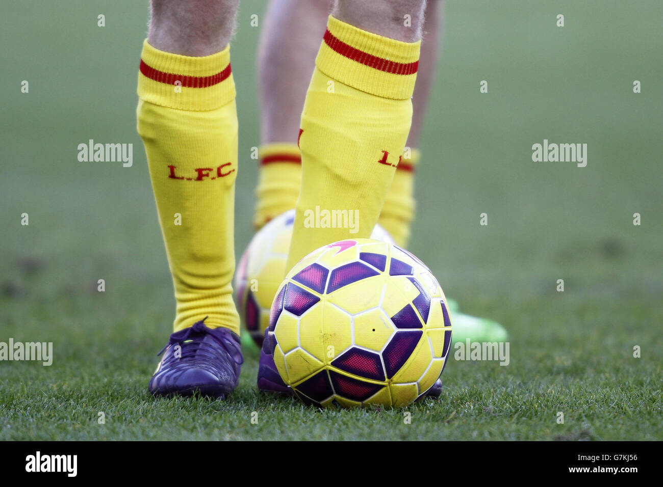 Soccer - Barclays Premier League - Sunderland v Liverpool - Stadium of Light. A shot of a Liverpool players legs with a ball and a socks with the letter L.F.C Stock Photo