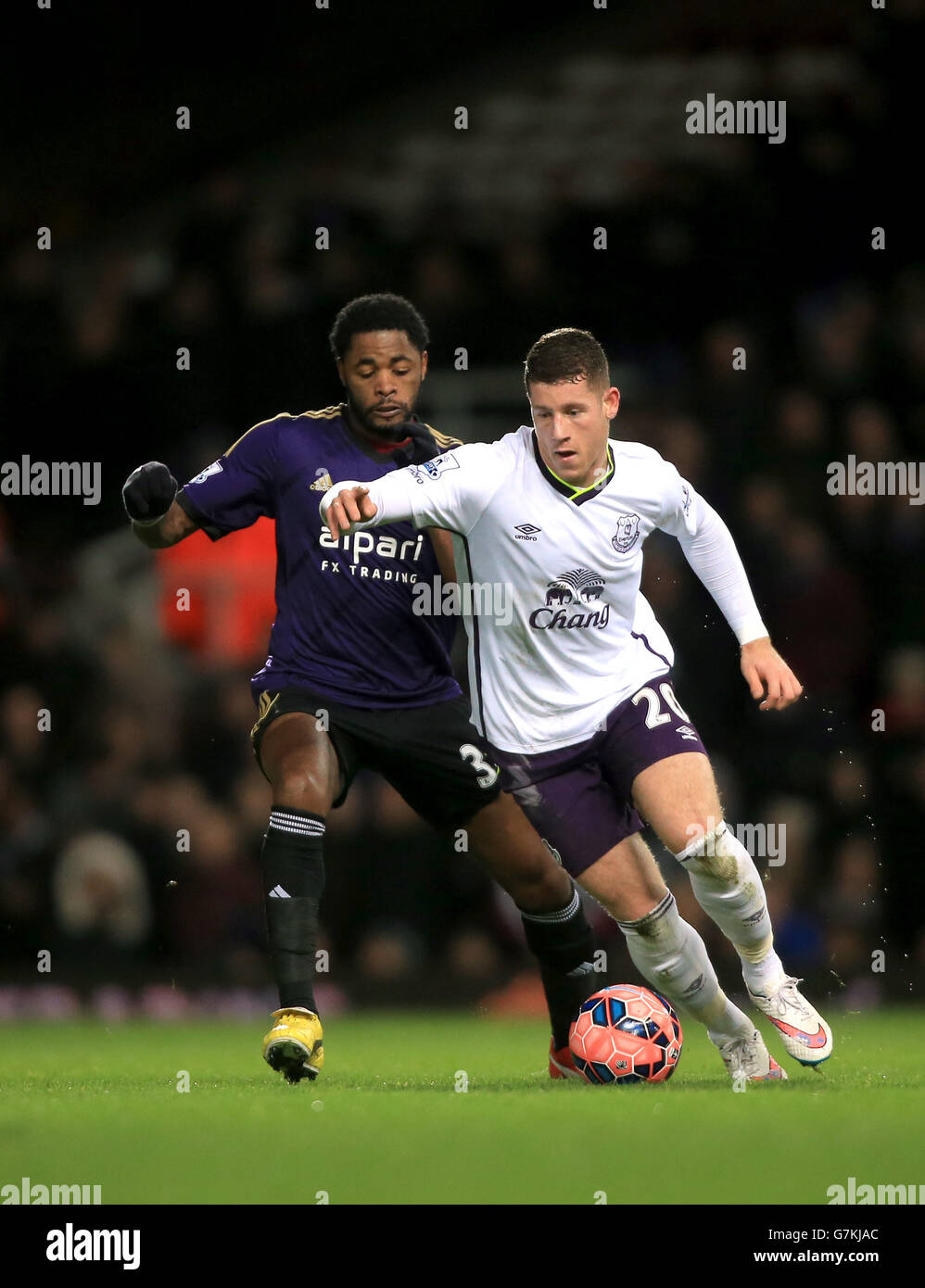 West Ham United's Alex Song (left) and Everton's Ross Barkley battle for the ball during the FA Cup Third Round replay match at Upton Park, London. Stock Photo