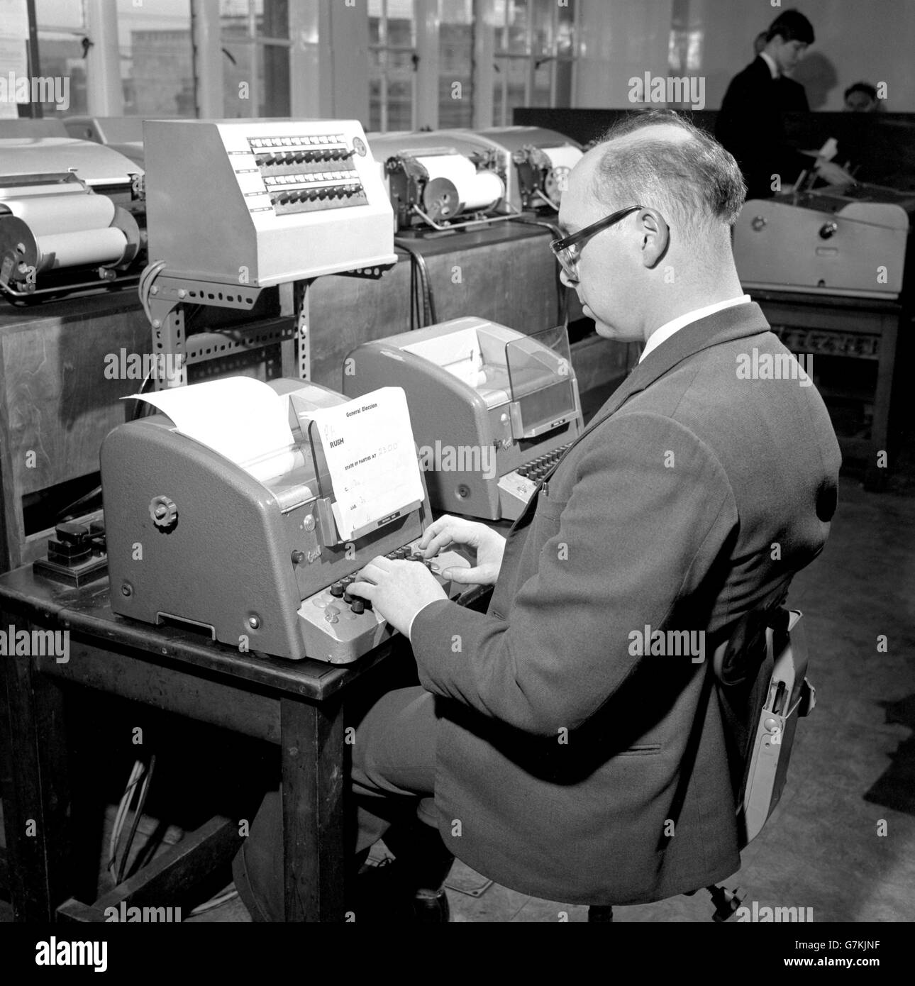 Nimble fingers key out Election results to newspaper, radio and television news rooms within seconds of being received in the Press Association headquarters in Fleet Street, London, from reporters and correspondents throughout Britain. Stock Photo