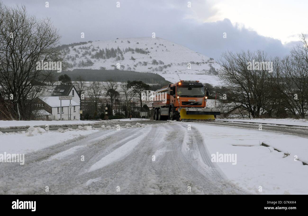 A snow plough in Troutbeck, Cumbria as temperatures will plunge below freezing across large swathes of the UK as the Met Office warns that severe cold weather and icy conditions could increase health risks to vulnerable patients and disrupt services. Stock Photo