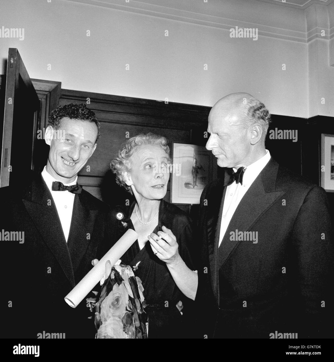 The two surviving 'Cockleshell Heroes', Lieutenant-Colonel H.G. Hasler RM (retired) (l) and ex-Royal Marine W.E. Sparks, enjoy a chat with Mary Lindell, an Englishwoman, formerly married to a Frenchman, who was the French Resistance leader 'Marie Claire'. A number of French Resistance workers were honoured by the Royal Marine Forces Volunteer Reserve in London for their help when members of a Royal Marine group - later to become known as the 'Cockleshell Heroes' - raided German shipping on the River Gironde in 1942. Stock Photo