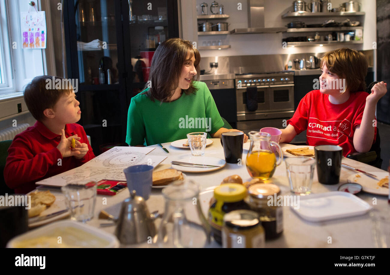 Samantha Cameron, the wife of Prime Minister David Cameron, has breakfast in her Downing Street apartment with Philip Kiley (left), eight, from Chorley in Lancashire, and Stevie Tyrie, eight, from Manchester, as part of her support for the charity Contact A Family which helps families with disabled children. Stock Photo