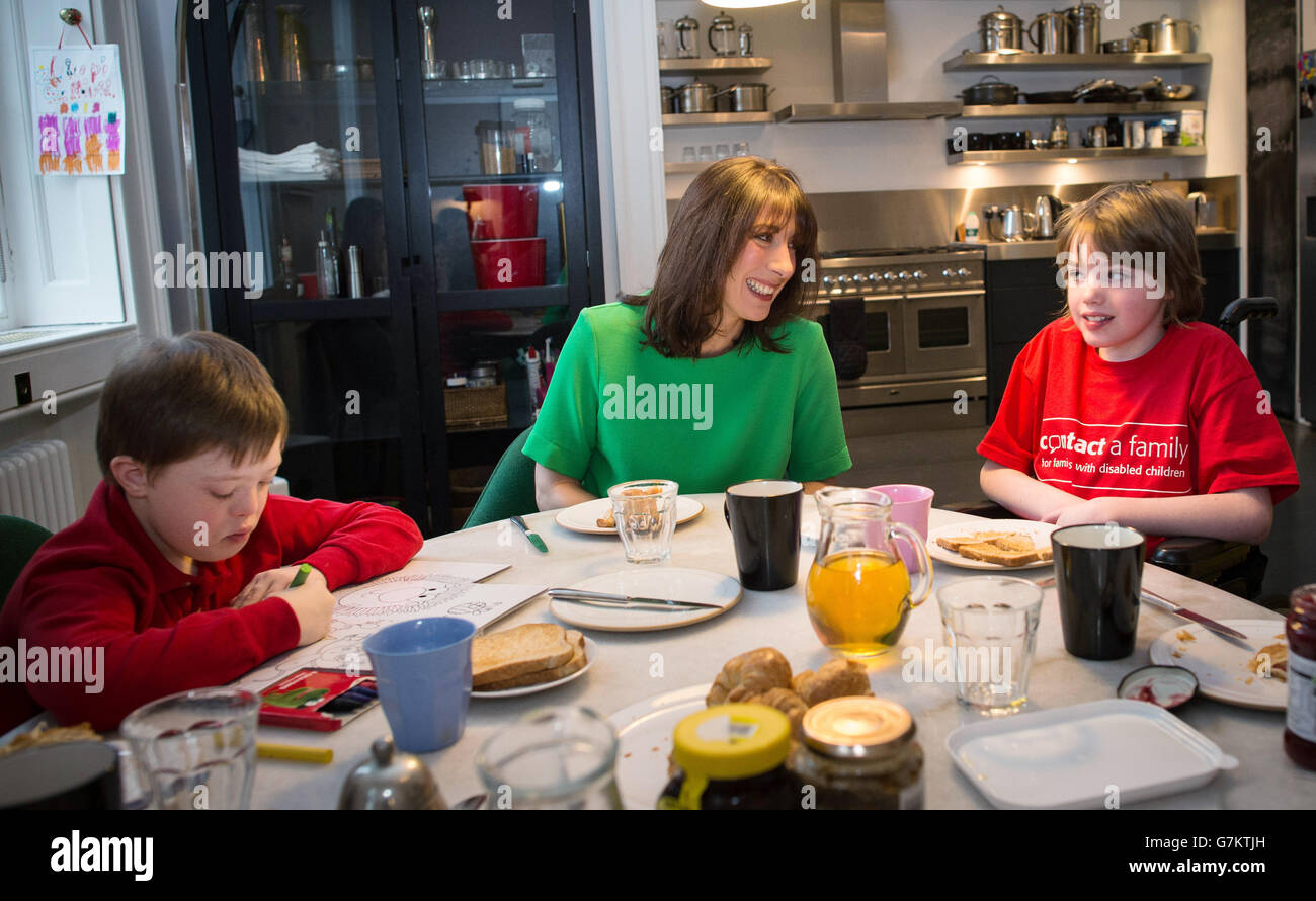 Samantha Cameron, the wife of Prime Minister David Cameron, has breakfast in her Downing Street apartment with Philip Kiley (left), eight, from Chorley in Lancashire, and Stevie Tyrie, eight, from Manchester, as part of her support for the charity Contact A Family which helps families with disabled children. Stock Photo