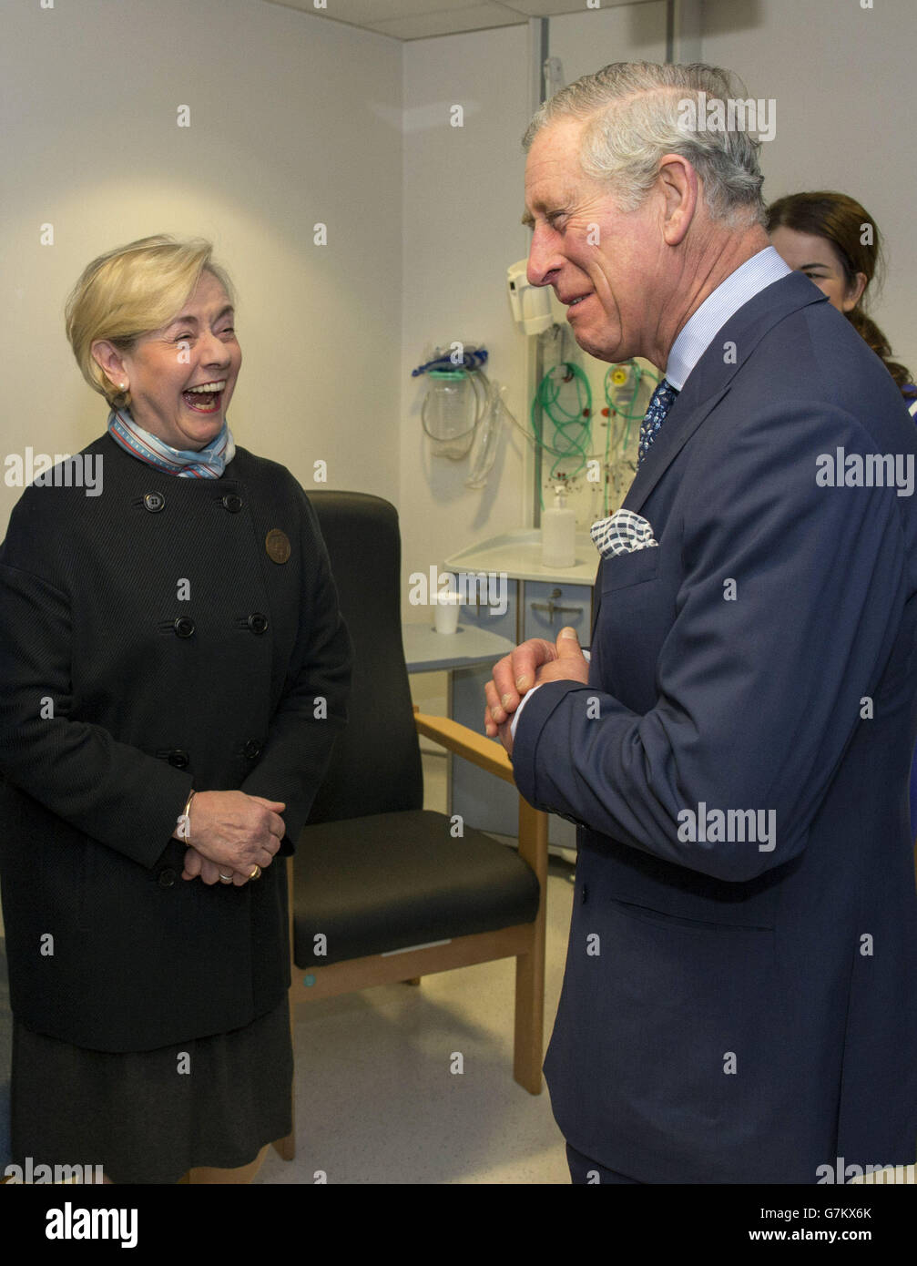 The Prince of Wales laughs with former patient Julia Lonsdale during a visit to St Mary's Hospital in Paddington, London, where he was shown groundbreaking medical technology used to train NHS doctors and nurses and treat patients - including a pop-up inflatable operating theatre. Stock Photo