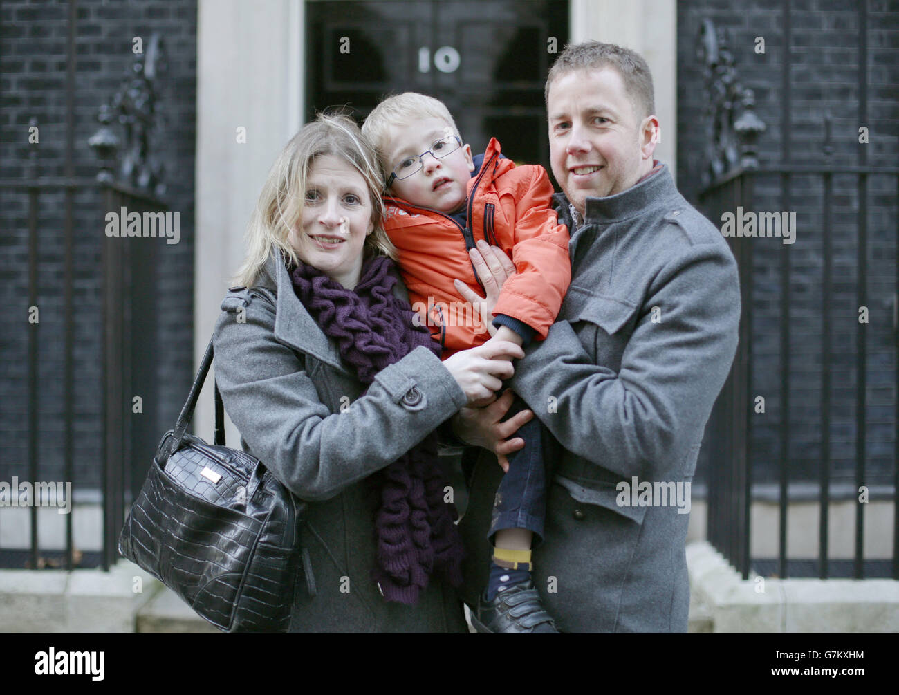Six year-old Sam Brown, of Otley, West Yorkshire - who is one of just 88 people in the UK with the ultra-rare condition Morquio Syndrome - with his parents Simon and Katy handing in a letter at 10 Downing Street, London, calling on the Prime Minister to take urgent action to fund the drugs he needs, as the drug company BioMarin stated that it will cease supplying his drugs, and NHS England uncertain to fund the drugs. Stock Photo