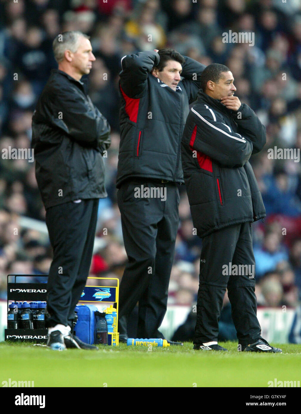 Nottingham Forest's caretaker manager Mick Harford (c) and coach Des Walker (r) stand dejected during the defeat against West Ham United Stock Photo