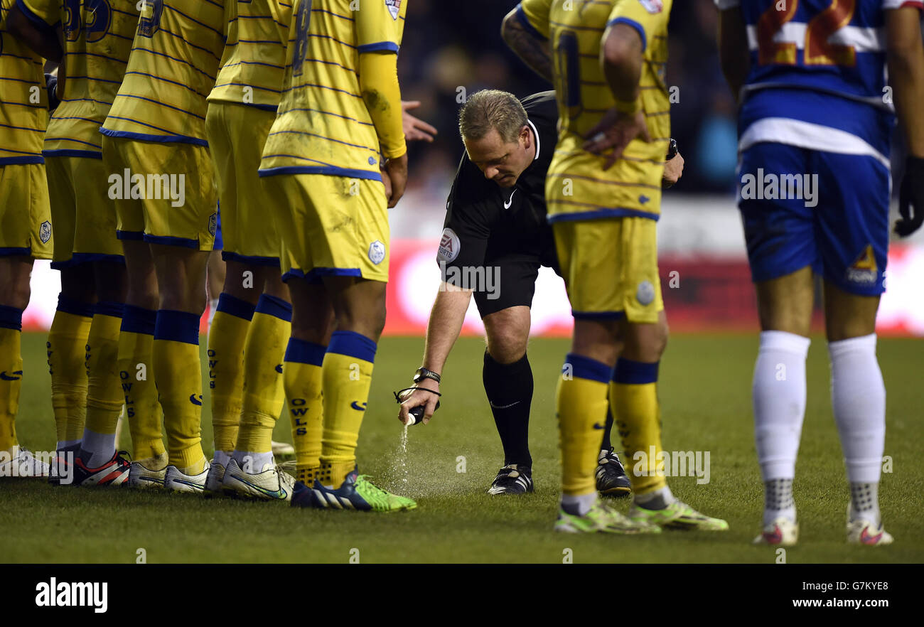 Referee Brendan Malone makes out a free kick by using vanishing spray Stock Photo