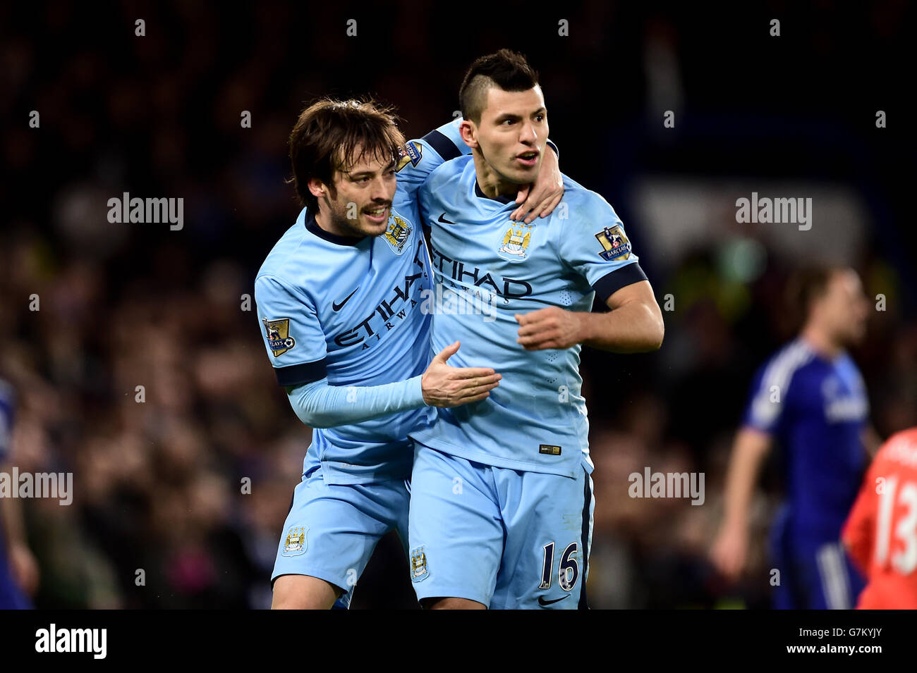 Manchester City's David Silva (left) celebrates with team mate Sergio Aguero (right) after scoring his sides first goal of the game during the Barclays Premier League match at Stamford Bridge, London. PRESS ASSOCIATION Photo. Picture date: Saturday January 31, 2015. See PA story SOCCER Chelsea. Photo credit should read: Adam Davy/PA Wire. Stock Photo