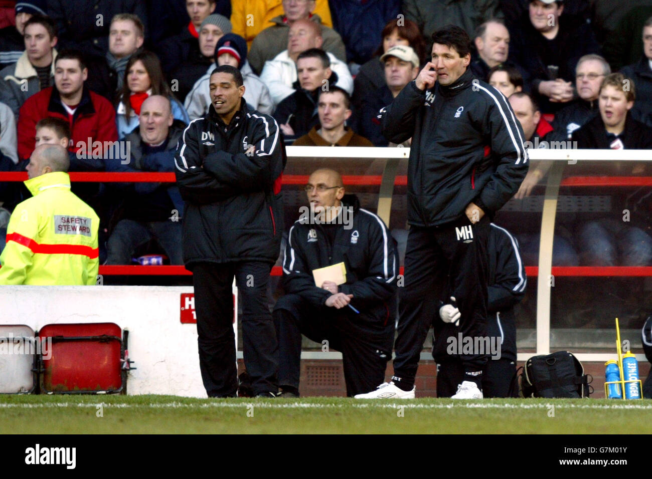 Nottingham Forest's caretaker manager Mick Harford watches his team in action as coach Des Walker looks on Stock Photo