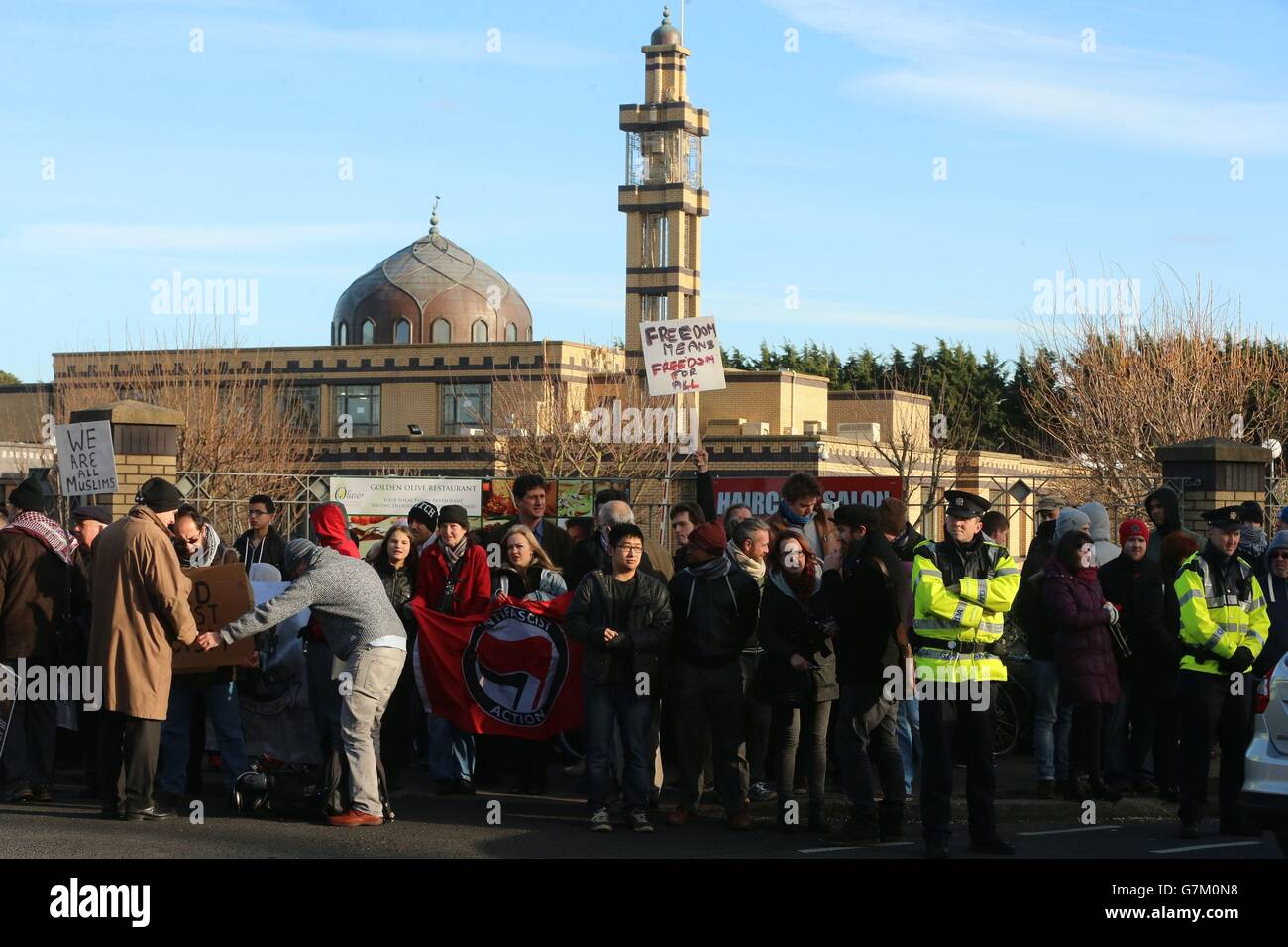 Photo. A counter-demonstration by Muslims and antif-fascist groups, as a small anti-Islam demonstration takes place opposite Clonskeagh Mosque in Dublin, after a campaign organized on Facebook. Stock Photo