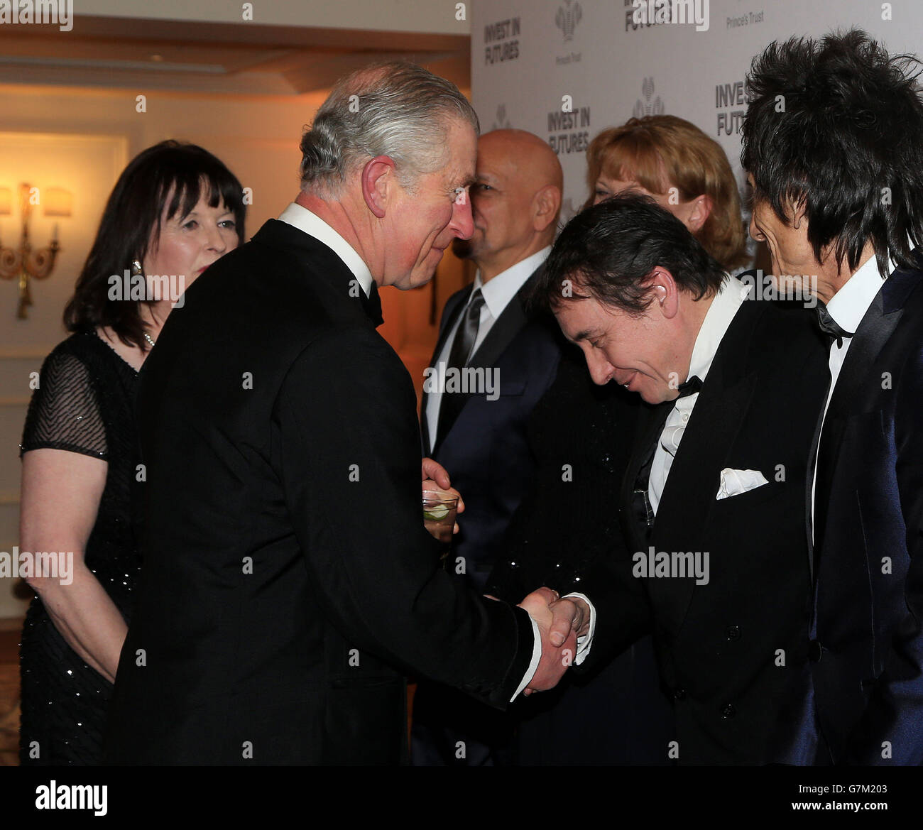The Prince of Wales meets (3rd left - right) Sir Ben Kingsley, Samantha Bond (partially obscured), Jools Holland and Ronnie Wood as he attends the annual Prince's Trust 'Invest In Futures' reception at the Savoy Hotel in London. Stock Photo