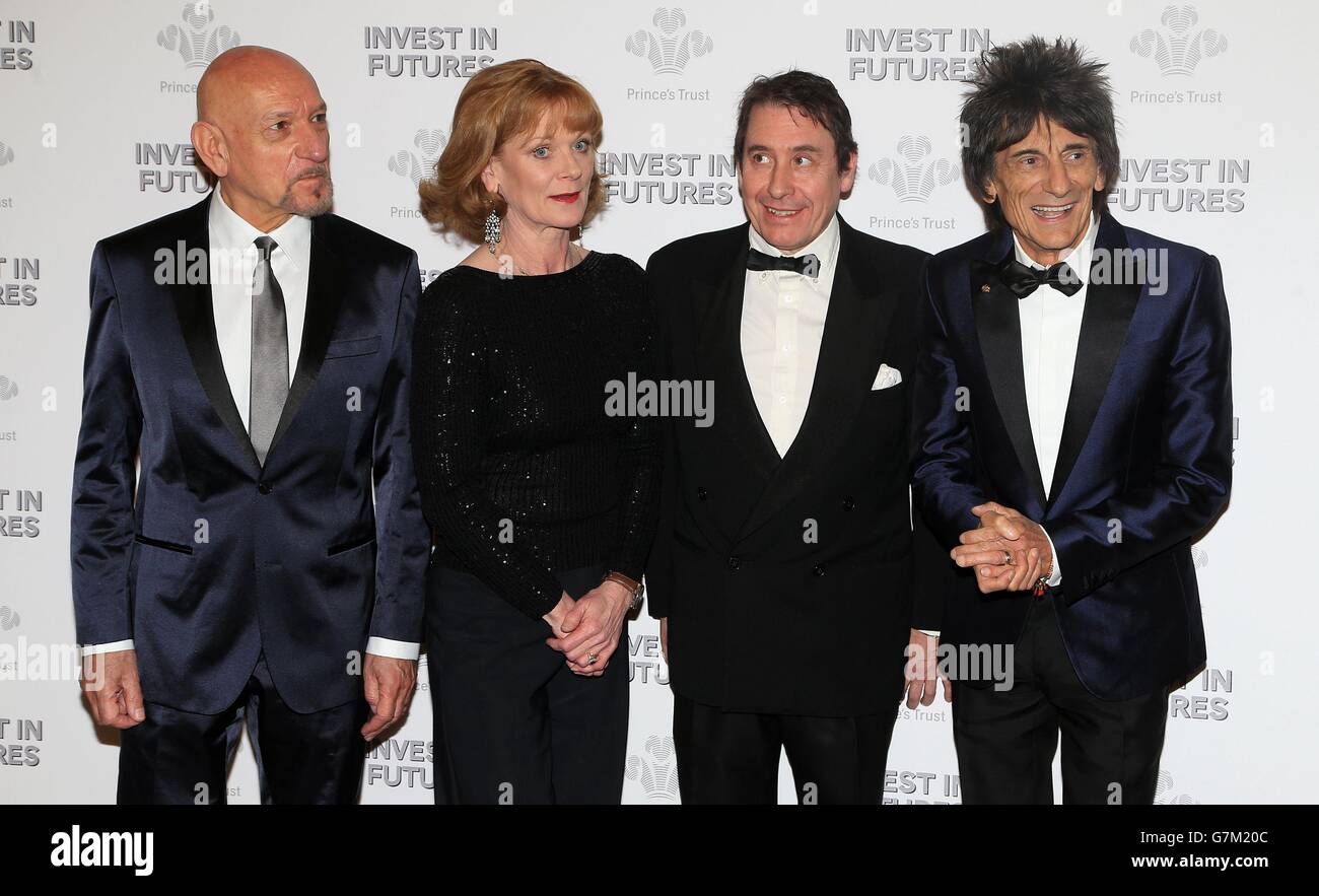 (Left - right) Sir Ben Kingsley, Samantha Bond, Jools Holland and Ronnie Wood wait to meet the Prince of Wales as he attends the annual Princes Trust 'Invest In Futures' reception at the Savoy Hotel in London. Stock Photo