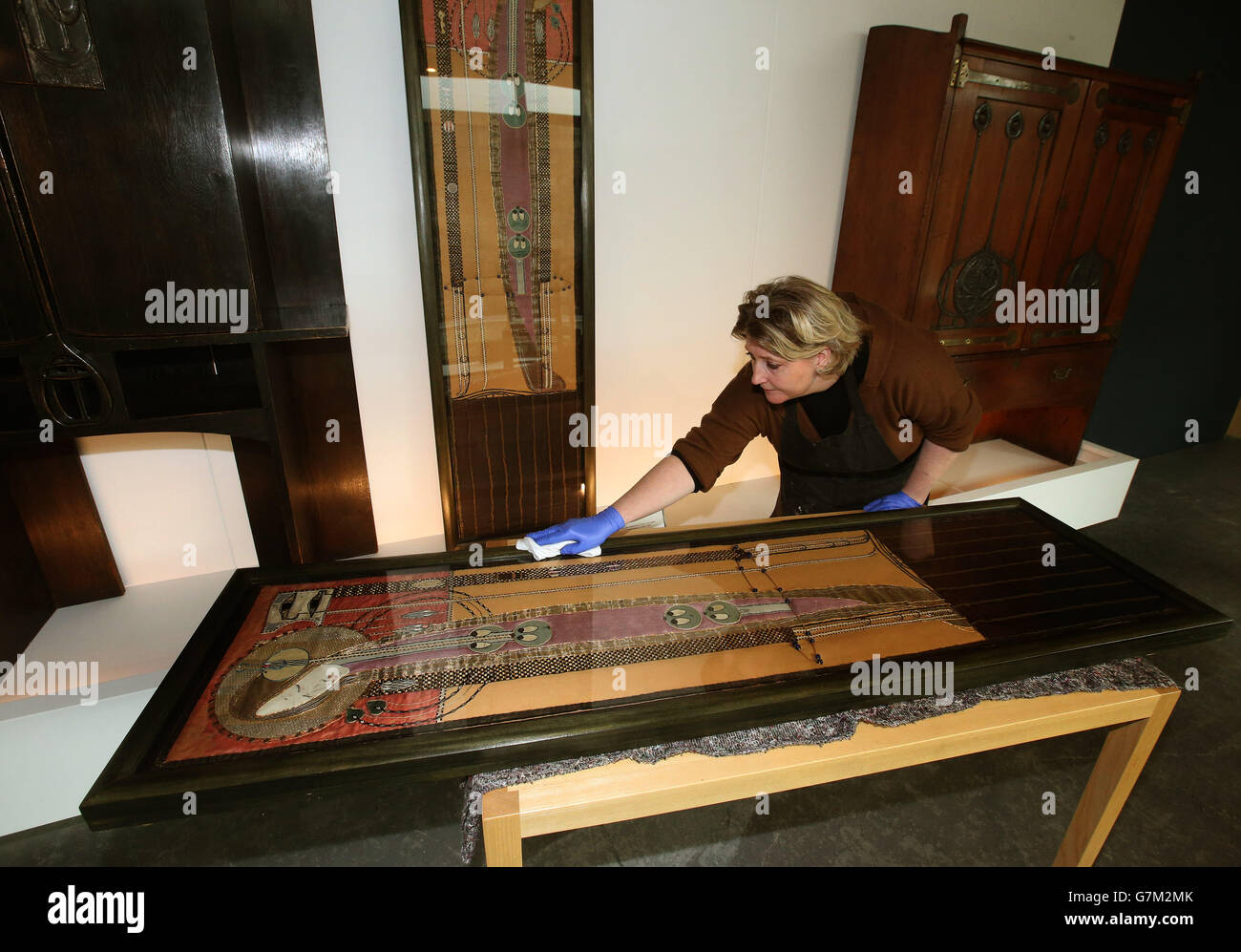Sarah Gerrish, Furniture and Wooden Artefact Conservator, with the pair